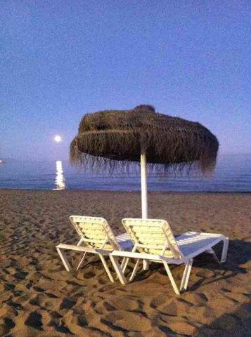 An evening scene on a beach in the south of Spain.